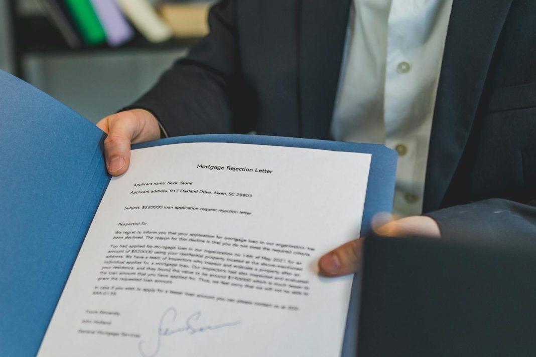 Bar chart showing common loan rejection reasons and next steps.